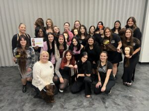 Cosmetology Students at The Salon Professional Academy receiving Hair Extension Certification